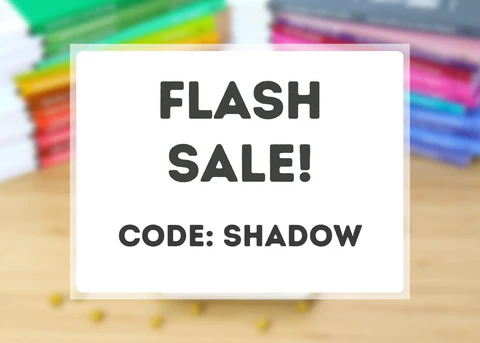 Sale details in black type overlaid on a blurred image of colorful books on a light wood table.