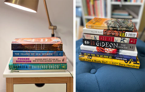 Photo of Katel’s TBR pile of books on her white, wooden nightstand next to a photo of Lisa Maria’s TBR pile of books on a blue ottoman.